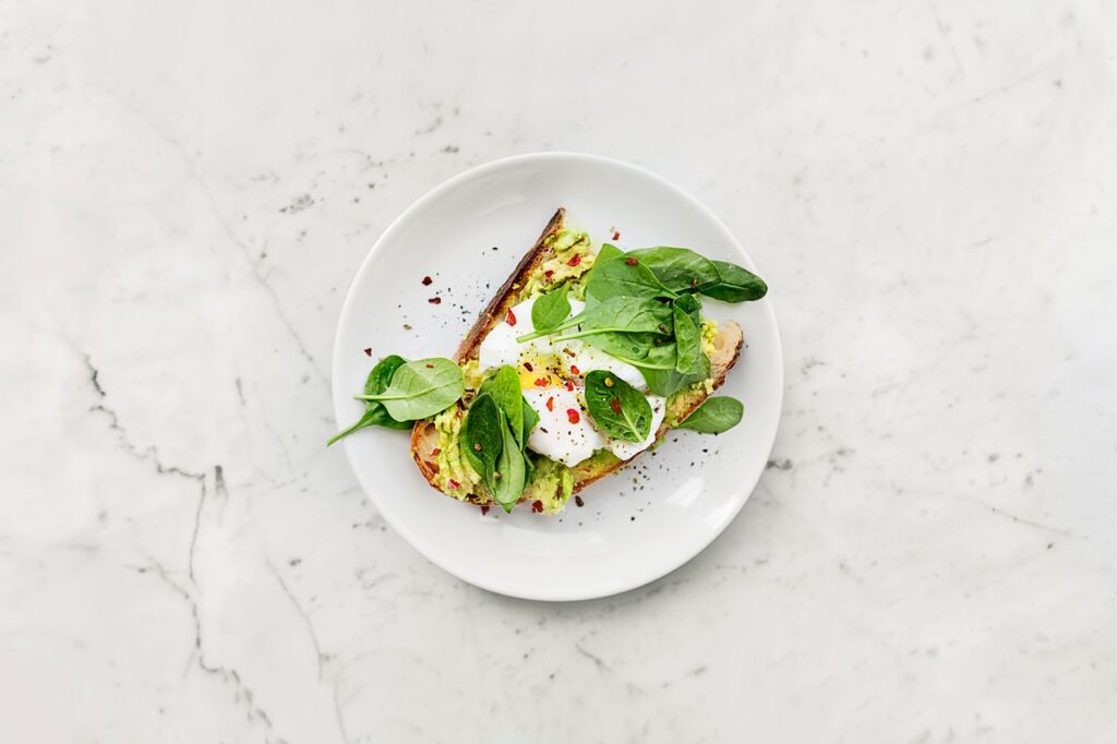 image of avocado toast on a marble surface  in a blog about overworked moms 