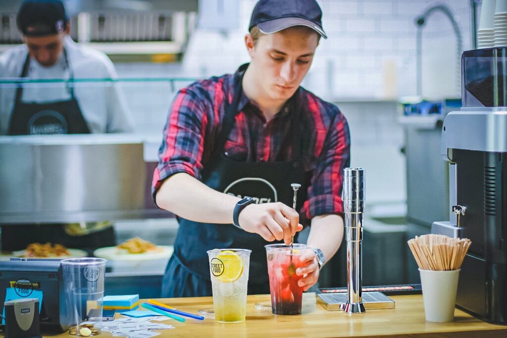 photo of a fast food worker in blog article about the importance of employers taking care of their employees in order to survive post pandemic shortage