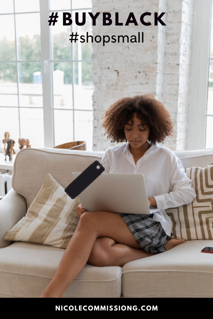 An image of an African American lady sitting on a chair working on a laptop .  working on a small business 