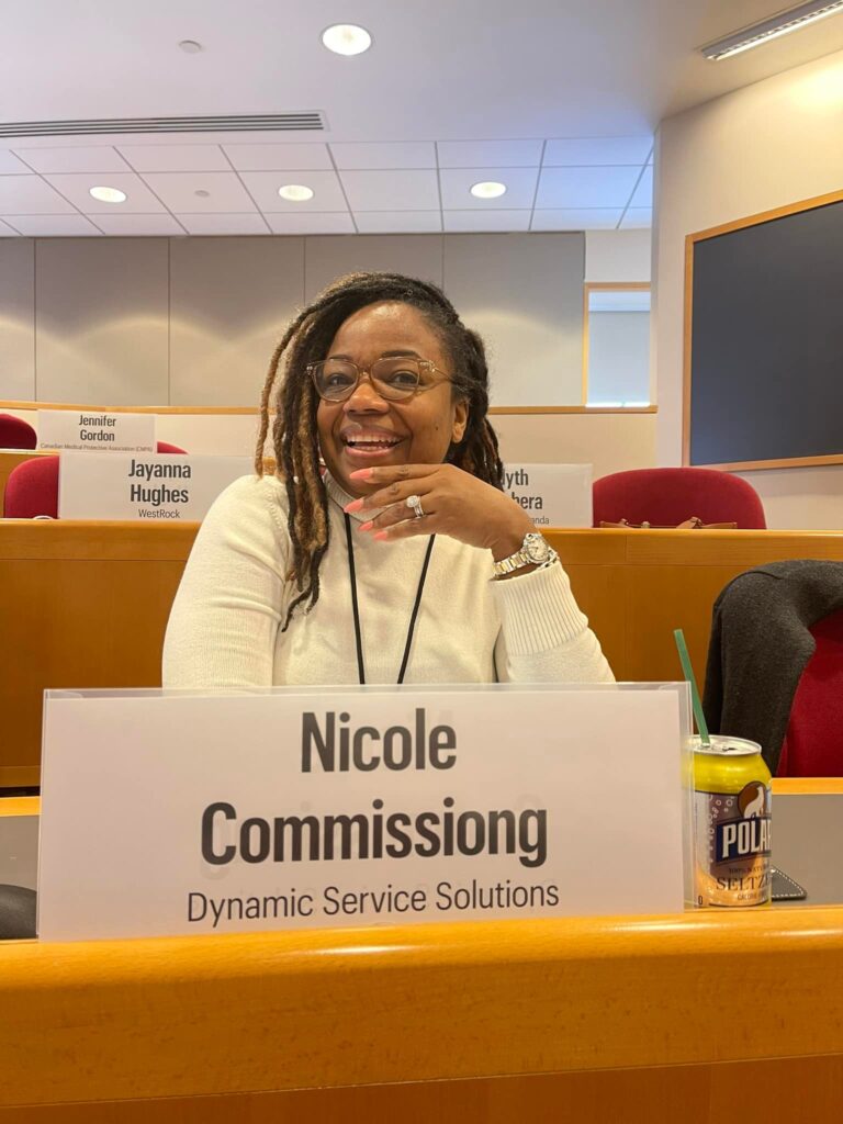 Image of Nicole Commissiong. https://nicolecommissiong.com/ of in a forum for women at harvard