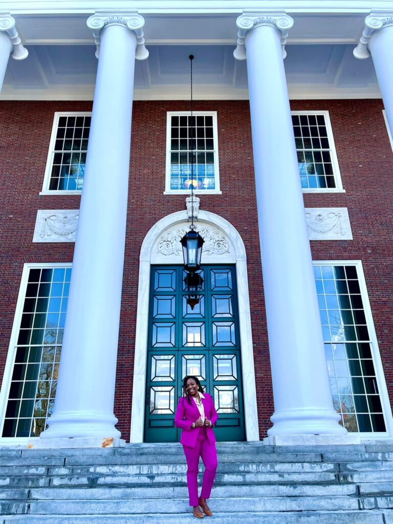 Image of Nicole Commissiong. https://nicolecommissiong.com/ of in a forum for women at harvard